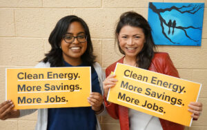 Melanie and Lavannya holding signs