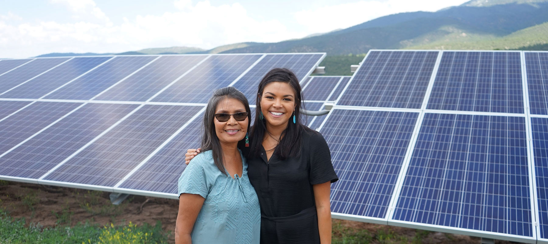 Mayane at right with Ann Barudin, touring Picuris Pueblo’s 1MW solar array