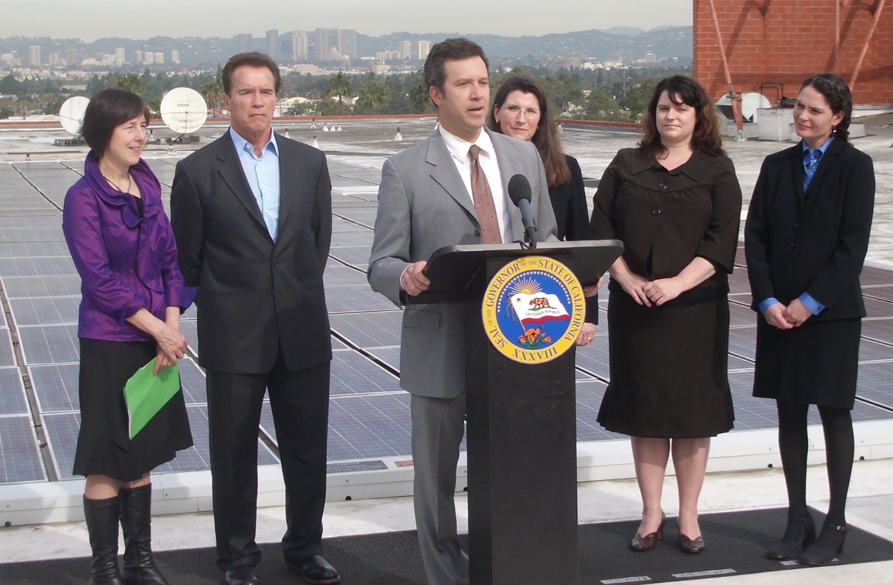 Adam with Nancy Skinner, Gov. Arnold Schwarzenegger, Julie Blunden, Sara Birmingham and Bernadette del Chiaro at the signing of AB 510 in 2010, which raised the net metering cap in California