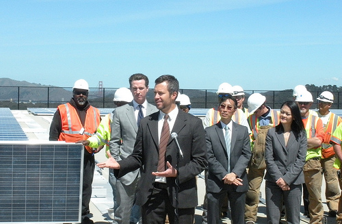 Adam at the Sunset Reservoir solar installation in 2010, one of the largest municipal solar arrays installed at the time in the U.S., with then-Mayor of San Francisco Gavin Newsom attending. 